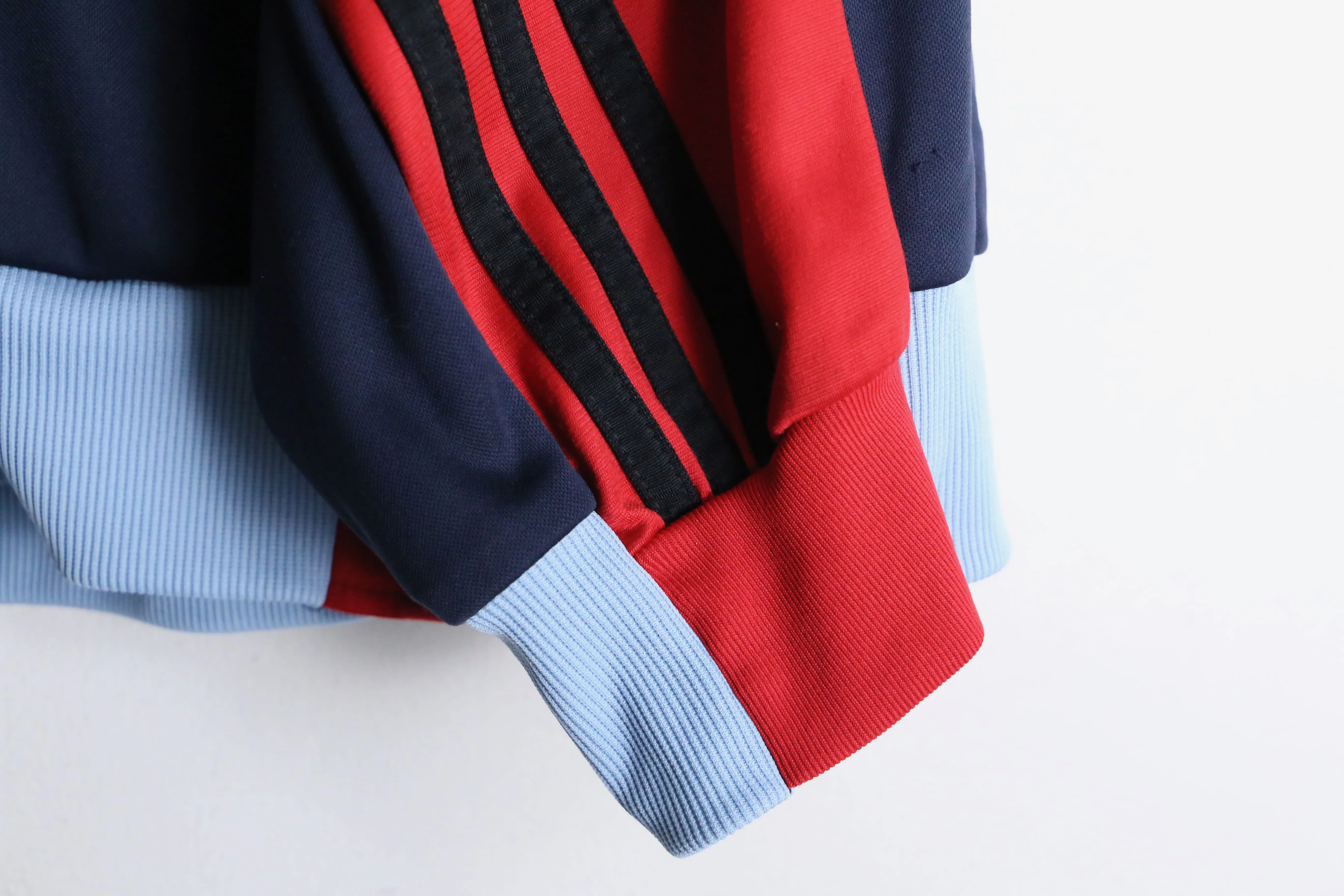 "Re:make" navy × red track jacket