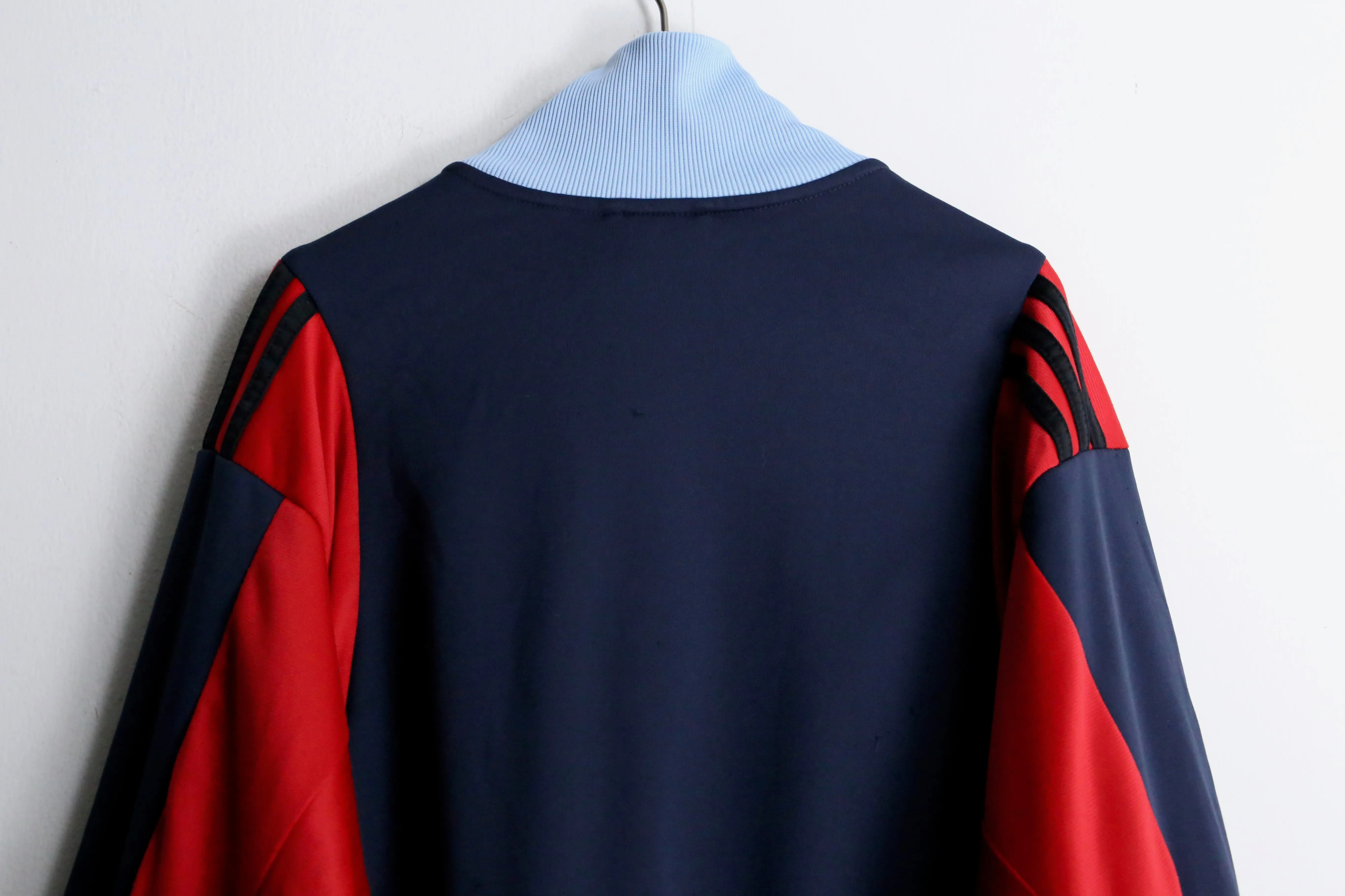 "Re:make" navy × red track jacket