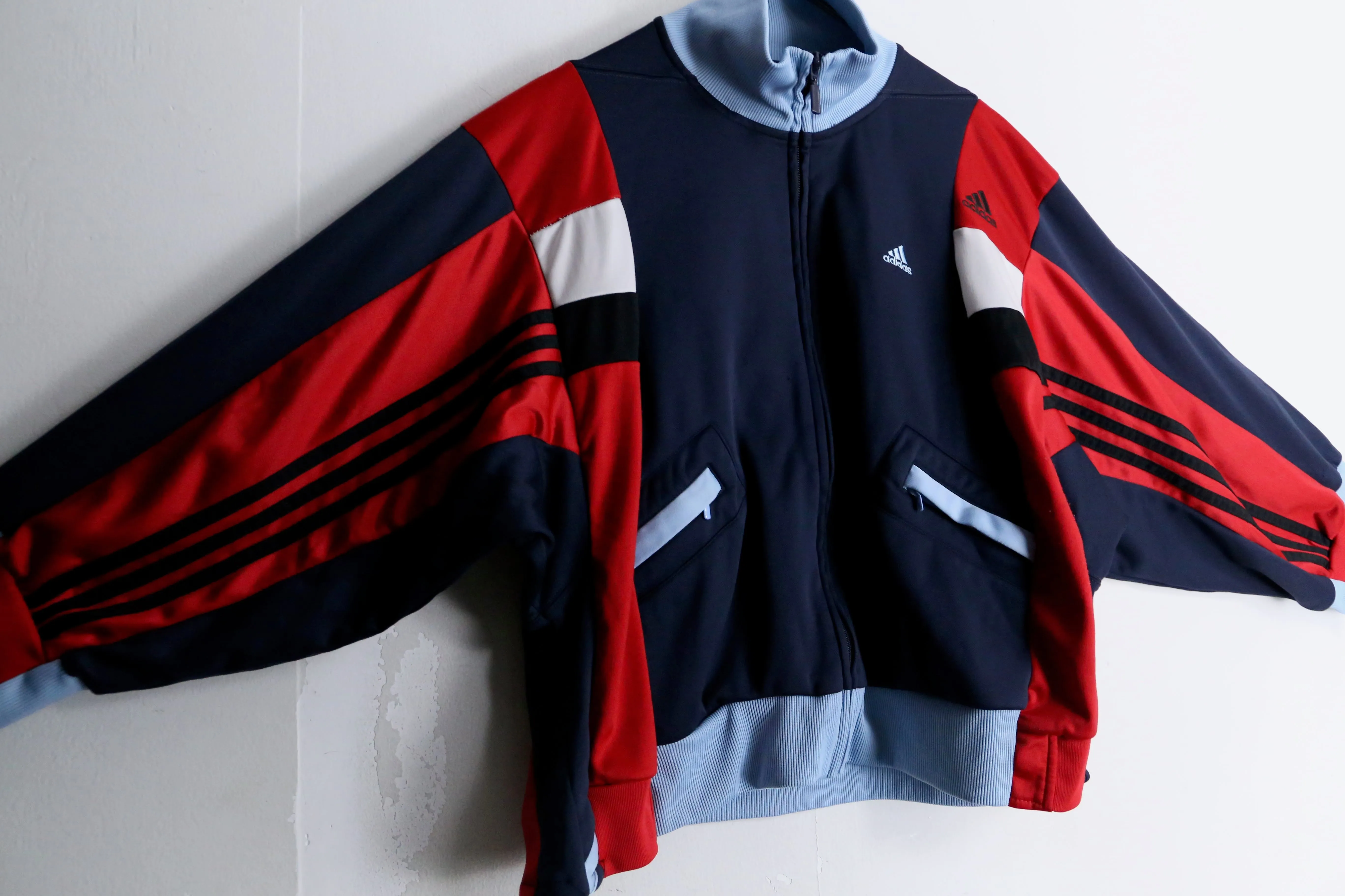 "Re:make" navy × red track jacket