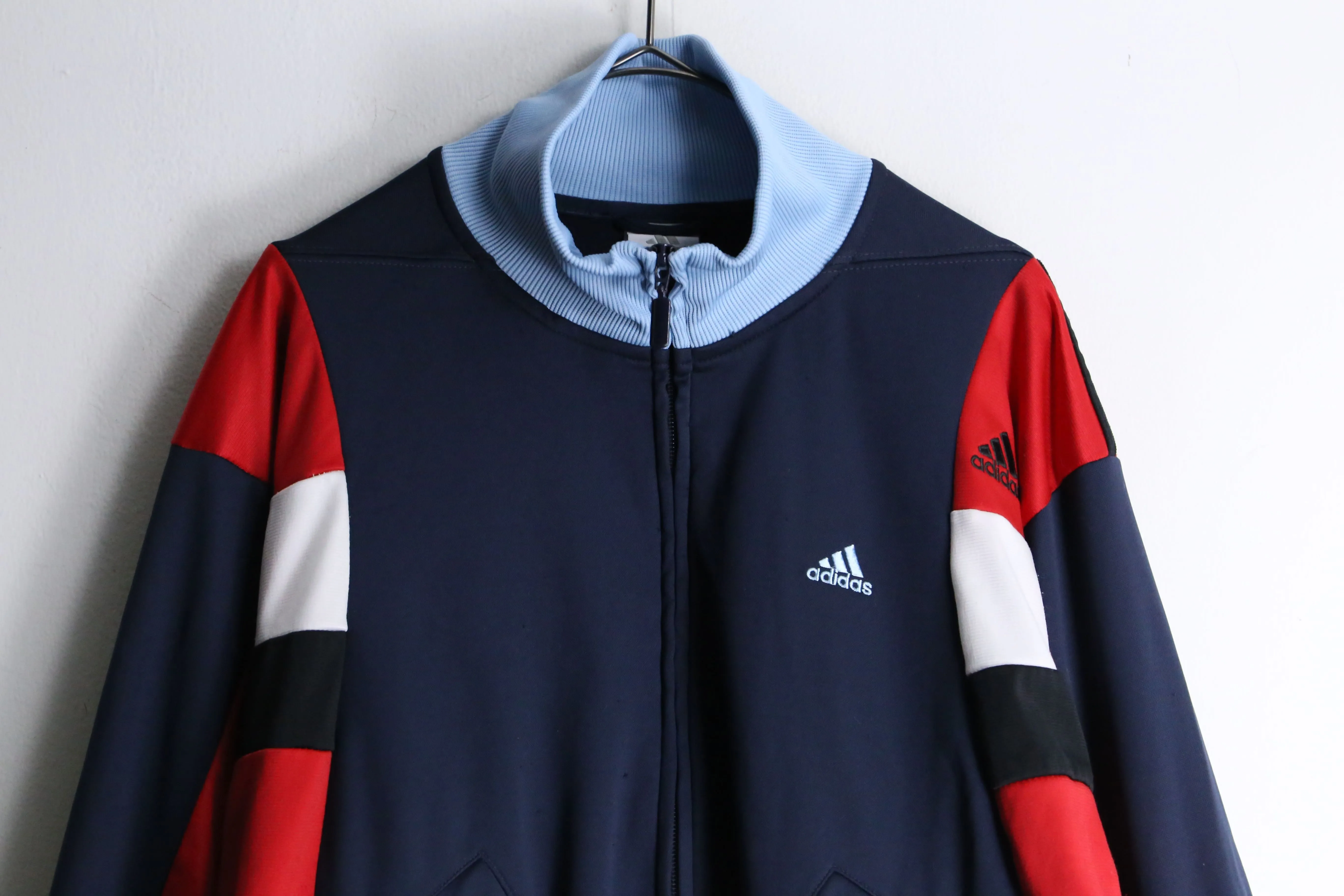 "Re:make" navy × red track jacket