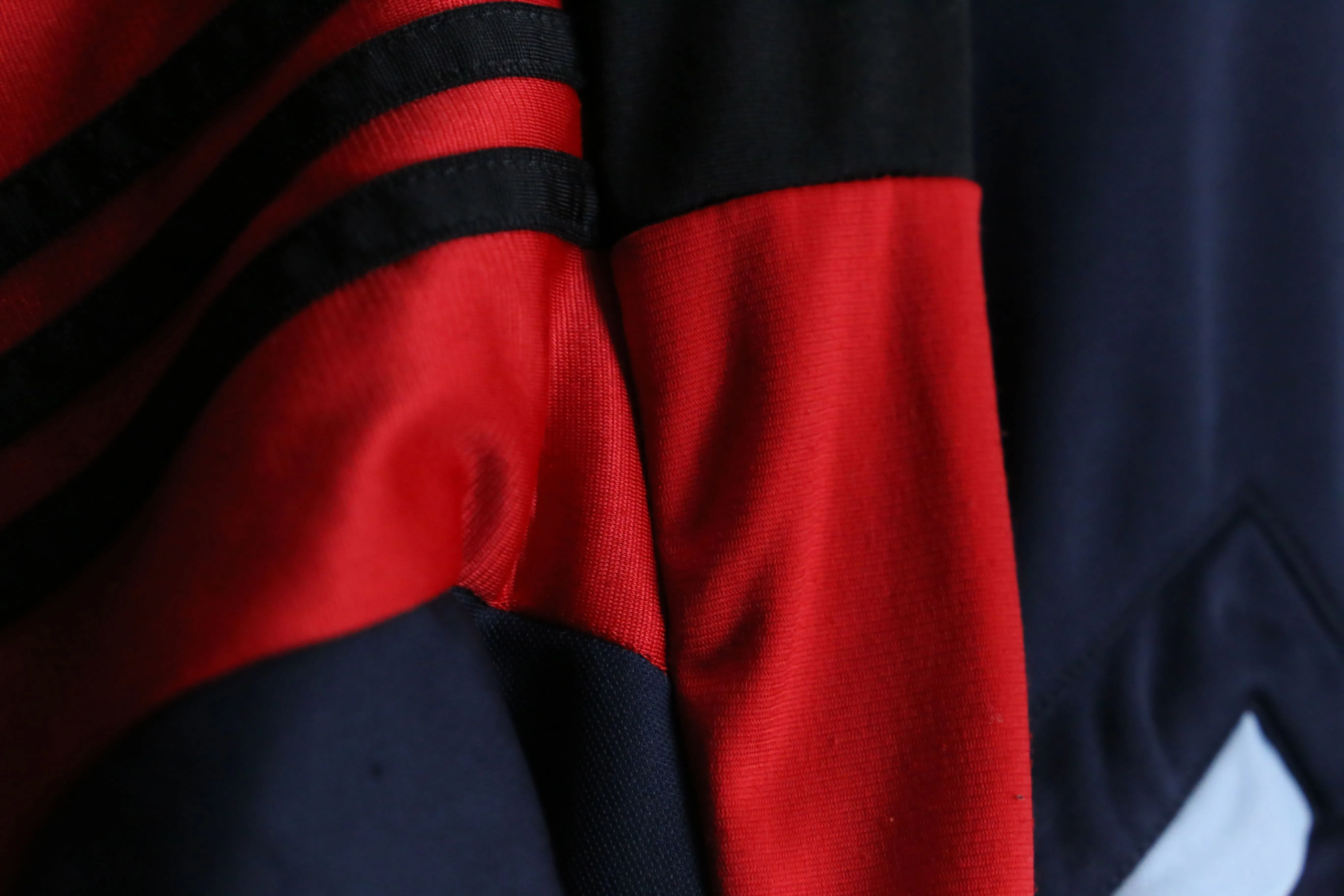 "Re:make" navy × red track jacket