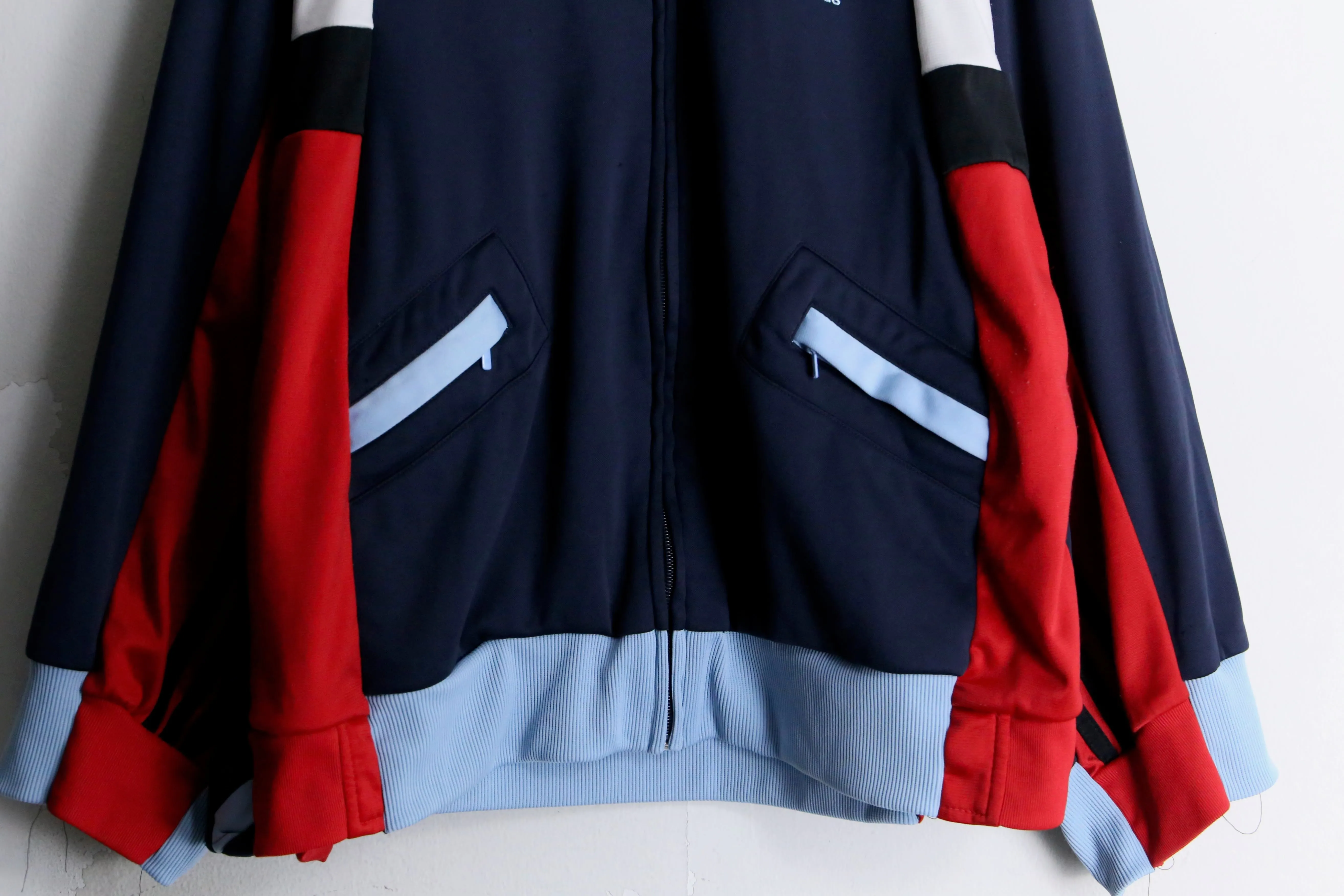 "Re:make" navy × red track jacket